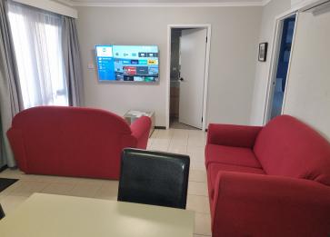 Two bedroom apartment 1 king 2 singles beds Best Western Apollo Bay lounge with cast TV
